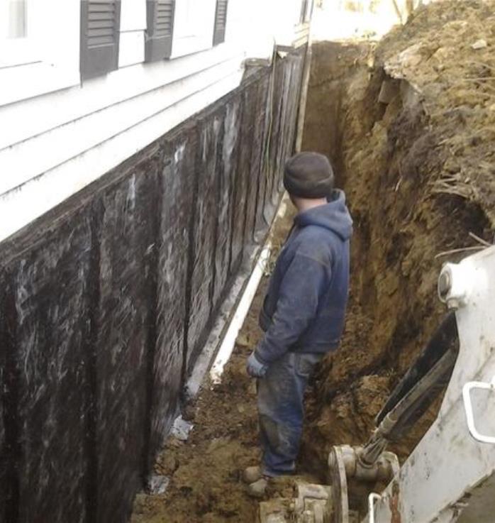 Applying Sealer coat to basement foundations